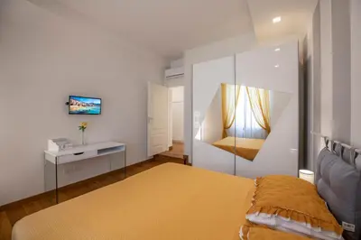 Letto o letti in una camera di Cherubini Apartment by Mamo Florence