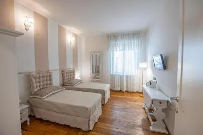 Letto o letti in una camera di Cherubini Apartment by Mamo Florence
