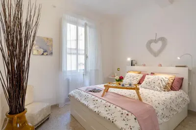 Letto o letti in una camera di Angelico Apartment