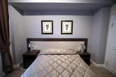 Letto o letti in una camera di FLORENCE ROOMS67