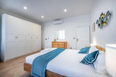Letto o letti in una camera di Roommo Via dei Pilastri giada
