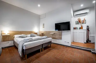 Letto o letti in una camera di Roommo Via dei Pilastri giada