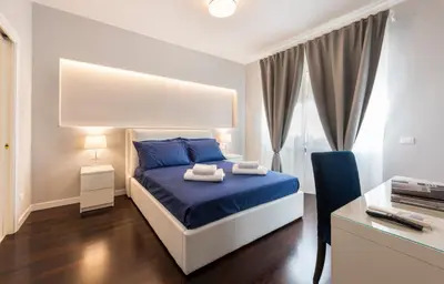 Letto o letti in una camera di Ponte Vecchio Deluxe Apartments