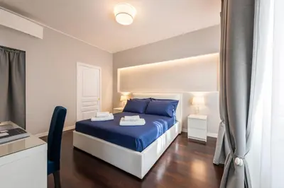Letto o letti in una camera di Ponte Vecchio Deluxe Apartments