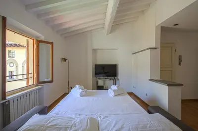 Letto o letti in una camera di Giorgio Ponte Vecchio Apartment