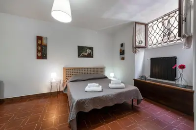 Letto o letti in una camera di Anguillara by Mmega
