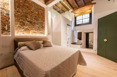 Letto o letti in una camera di La Bottega del Ferro by Mmega