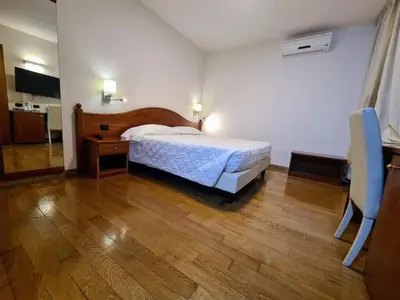 Letto o letti in una camera di Hotel La Villetta