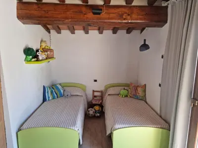 Letto o letti in una camera di Podere I Ripidi