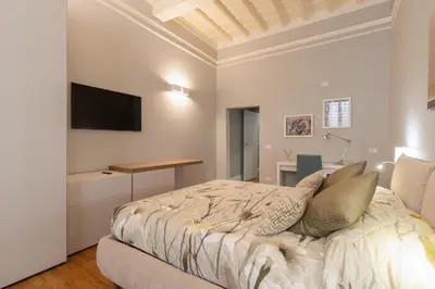 Letto o letti in una camera di Firenze Rentals Deluxe Corso 5