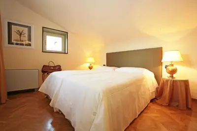 Letto o letti in una camera di Palazzo Gamba Apartments al Duomo