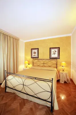 Letto o letti in una camera di Palazzo Gamba Apartments al Duomo