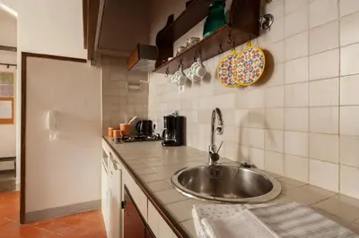 Cucina o angolo cottura di Aurora Suite, inside historic centre, few steps from Uffizzi, AC bedrooom, brand new in-room BTH, 2nd floor, walking distance from all sites