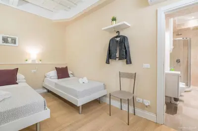 Letto o letti in una camera di Wine Apartments Florence Barolo