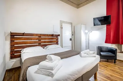 Letto o letti in una camera di Roommo Pergola Apartment