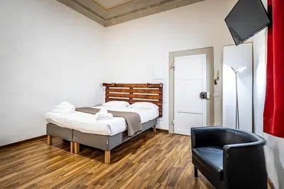 Letto o letti in una camera di Roommo Pergola Apartment