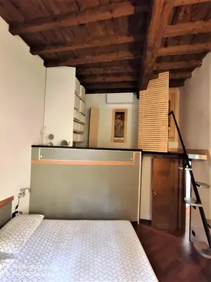 Letto o letti in una camera di CAREGGI GARDEN APARTMENT