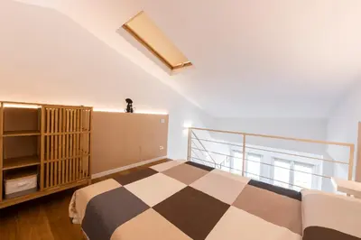 Letto o letti in una camera di Ruote Stylish Loft by Mmega