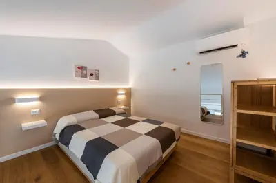 Letto o letti in una camera di Ruote Stylish Loft by Mmega