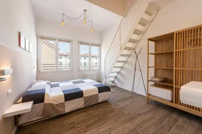 Letto o letti in una camera di Ruote Stylish Loft by Mmega