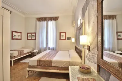 Letto o letti in una camera di MADAMA GUEST HOUSE