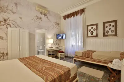 Letto o letti in una camera di MADAMA GUEST HOUSE