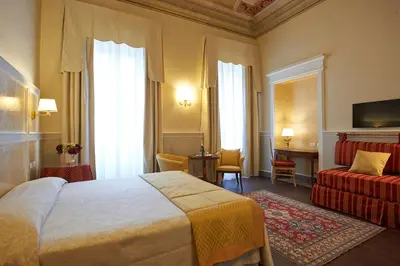 Letto o letti in una camera di Hotel Firenze Capitale