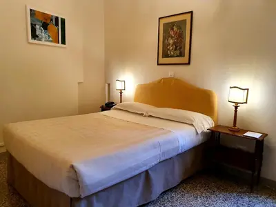 Letto o letti in una camera di Hotel Annalena
