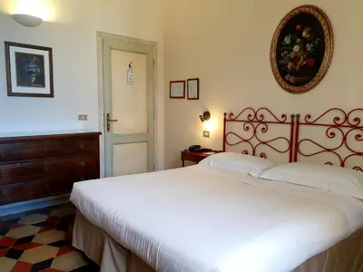 Letto o letti in una camera di Hotel Annalena
