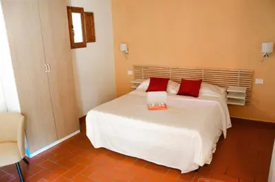Letto o letti in una camera di Lebbiano Residence