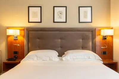 Letto o letti in una camera di Hotel Embassy