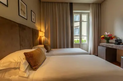 Letto o letti in una camera di Hotel Embassy