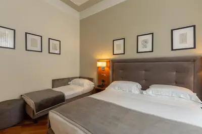 Letto o letti in una camera di Hotel Embassy