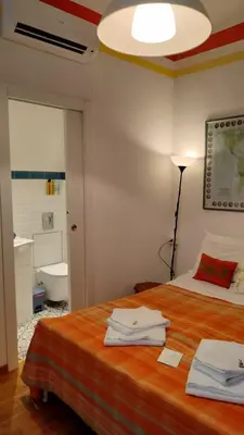 Letto o letti in una camera di BB Tre Gigli Firenze stazione, via Palazzuolo 55