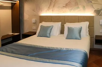 Letto o letti in una camera di Hotel Marzia