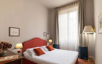 Letto o letti in una camera di Palazzo Alfani - Residenza d'Epoca