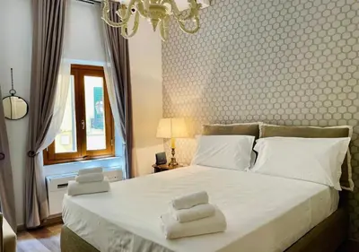 Letto o letti in una camera di Santa Maria Novella apt