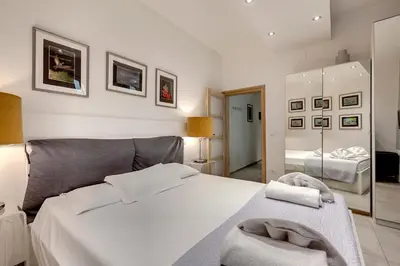 Letto o letti in una camera di Conce Apartment by Mamo Florence