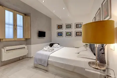 Letto o letti in una camera di Conce Apartment by Mamo Florence