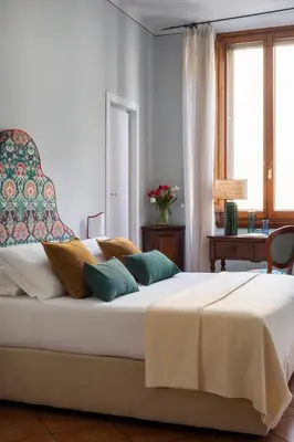Letto o letti in una camera di Hotel Galileo
