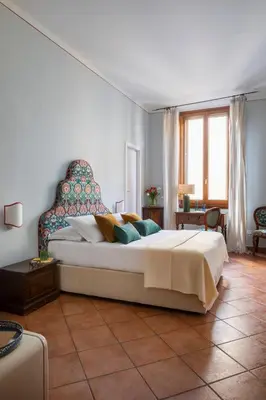 Letto o letti in una camera di Hotel Galileo
