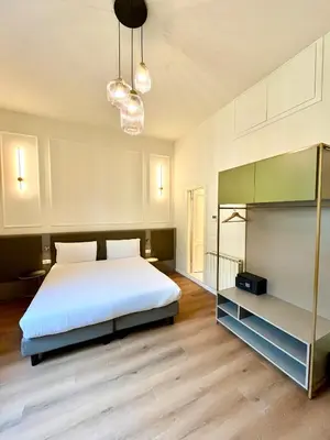 Letto o letti in una camera di Hotel Duca D'Aosta