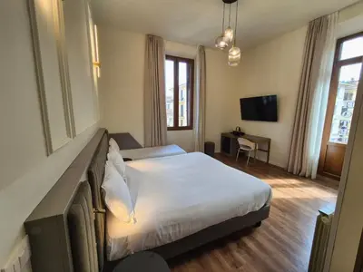 Letto o letti in una camera di Hotel Duca D'Aosta