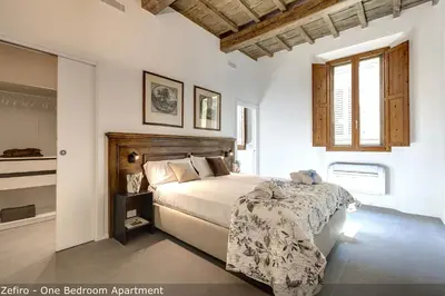 Letto o letti in una camera di Venere & Zefiro Apartments by Mamo Florence