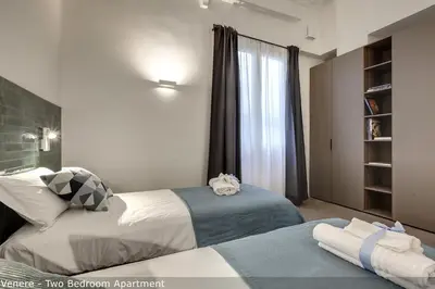 Letto o letti in una camera di Venere & Zefiro Apartments by Mamo Florence