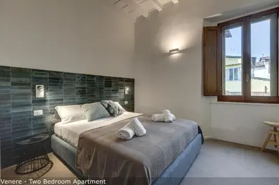 Letto o letti in una camera di Venere & Zefiro Apartments by Mamo Florence