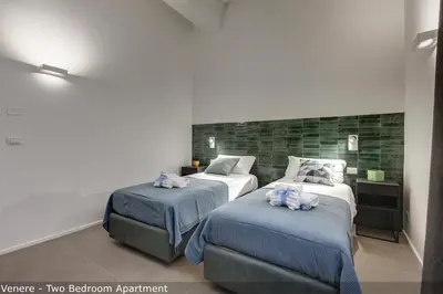 Letto o letti in una camera di Venere & Zefiro Apartments by Mamo Florence