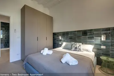 Letto o letti in una camera di Venere & Zefiro Apartments by Mamo Florence