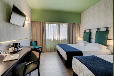 Letto o letti in una camera di Best Western Plus CHC Florence