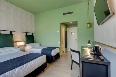 Letto o letti in una camera di Best Western Plus CHC Florence